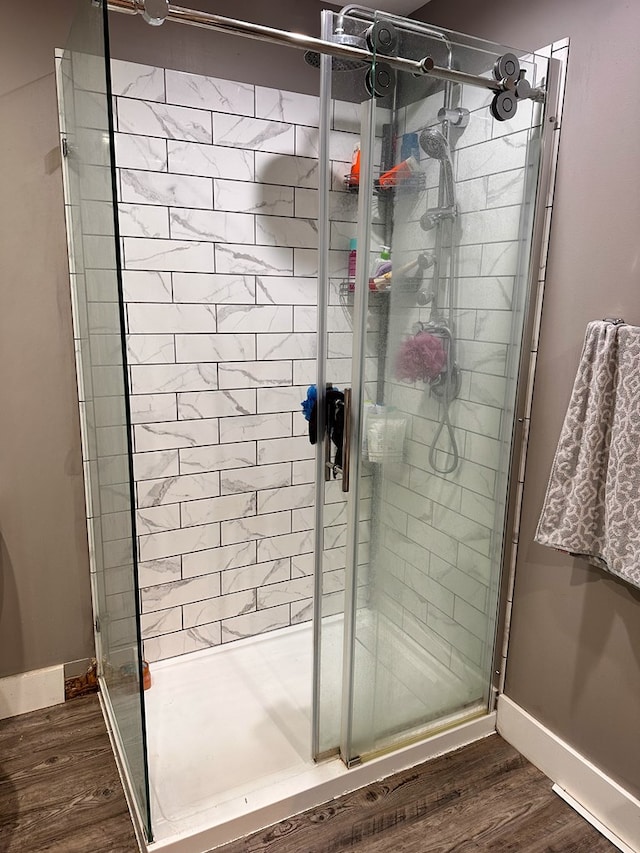 62 Canoe Camp Creek Rd, Mansfield, PA 16933 - full bath with baseboards, a stall shower, and wood finished floors