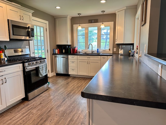 62 Canoe Camp Creek Rd, Mansfield, PA 16933 - kitchen featuring a sink, dark countertops, and stainless steel appliances