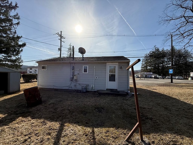 rear view of house with an outbuilding