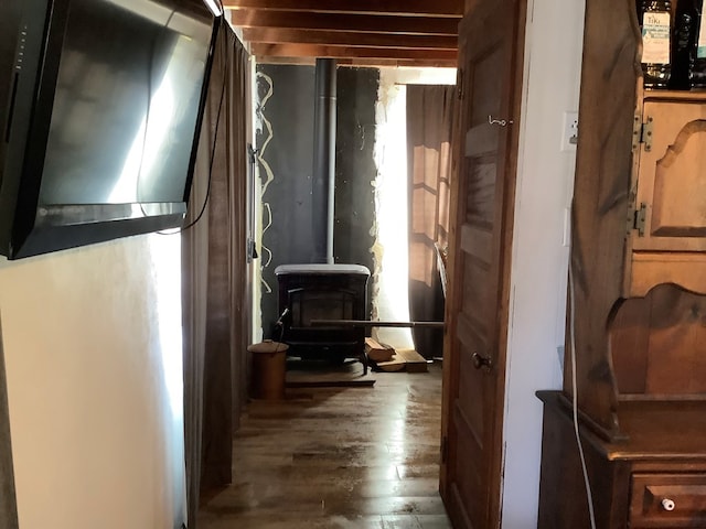 hall with beam ceiling and dark hardwood / wood-style floors