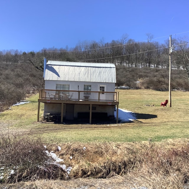 exterior space featuring a yard and a deck