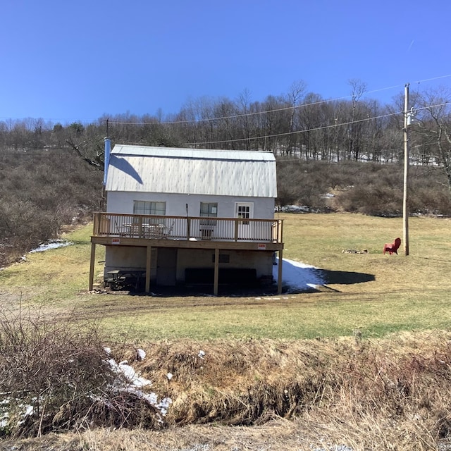 153 Zoerb Hollow Rd, Galeton, PA 16922 - rear view of property featuring a wooden deck, a metal roof, and a lawn