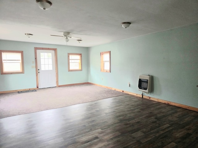 129 Liberty Corners Rd, Towanda, PA 18848 - unfurnished living room featuring baseboards, a ceiling fan, heating unit, and wood finished floors