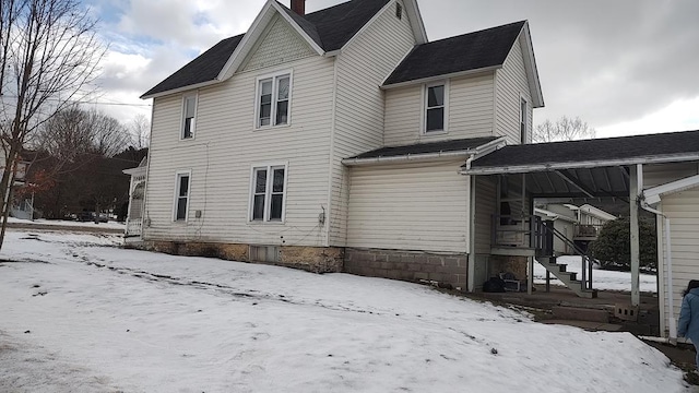 view of snow covered property