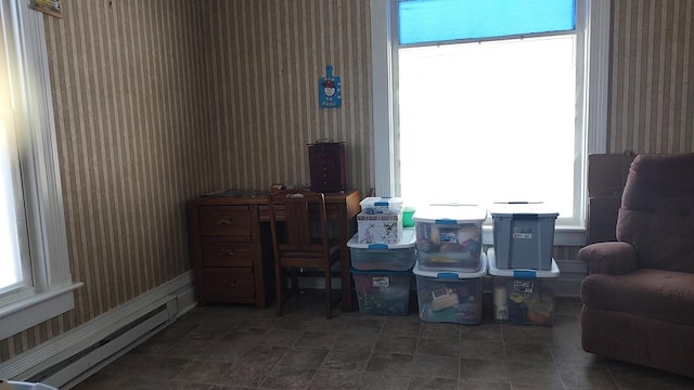 sitting room featuring a baseboard heating unit