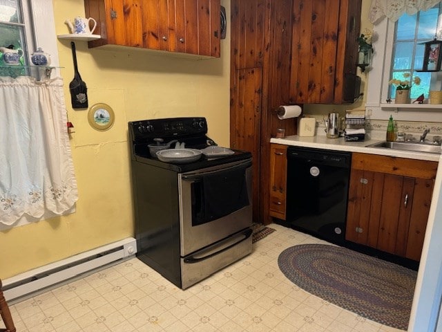 kitchen featuring black appliances, sink, and baseboard heating