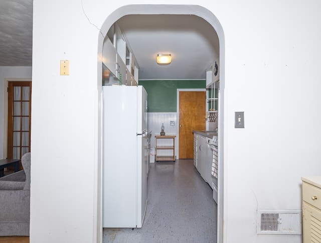 kitchen featuring stove and white refrigerator