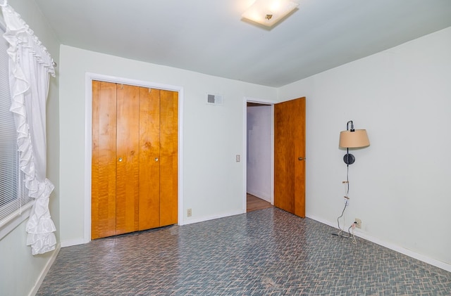 unfurnished bedroom with baseboards