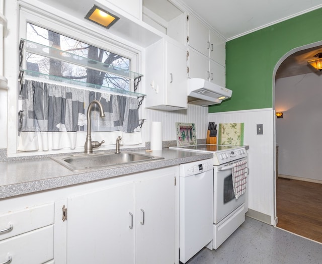 kitchen featuring white cabinetry, sink, and white appliances