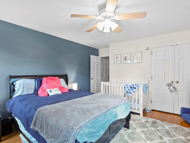 bedroom featuring a ceiling fan and wood finished floors