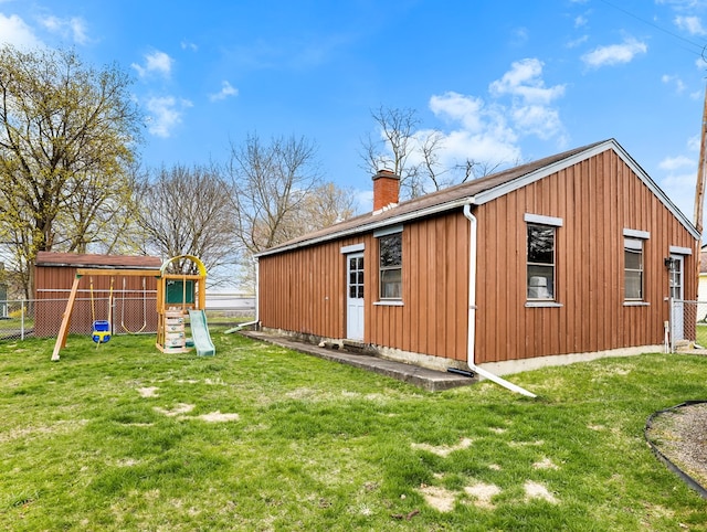 exterior space featuring fence private yard and a playground