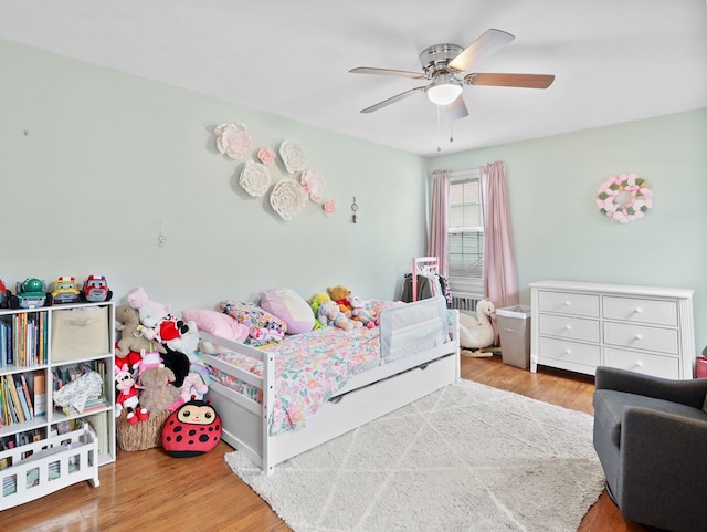 bedroom featuring ceiling fan and wood finished floors