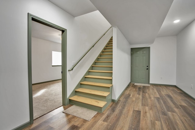 stairway with wood-type flooring