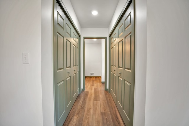 hall featuring wood-type flooring