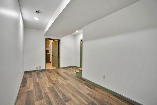 spare room with hardwood / wood-style floors