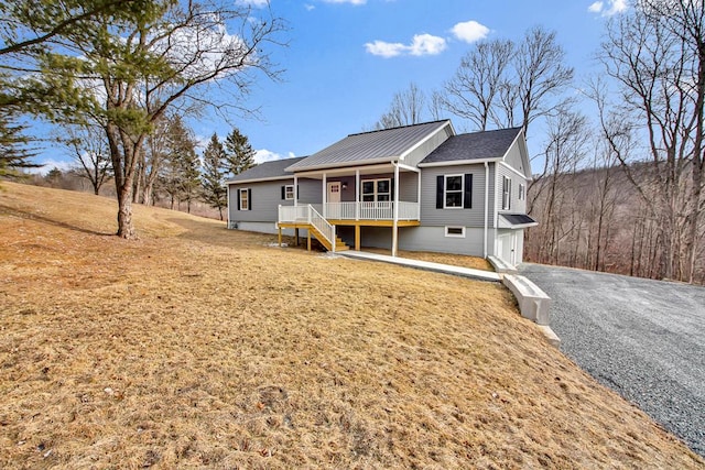 view of front of property with a porch and a garage