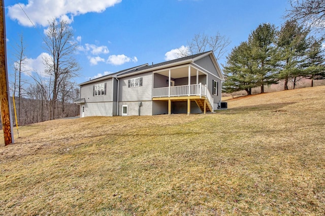 back of house with a lawn