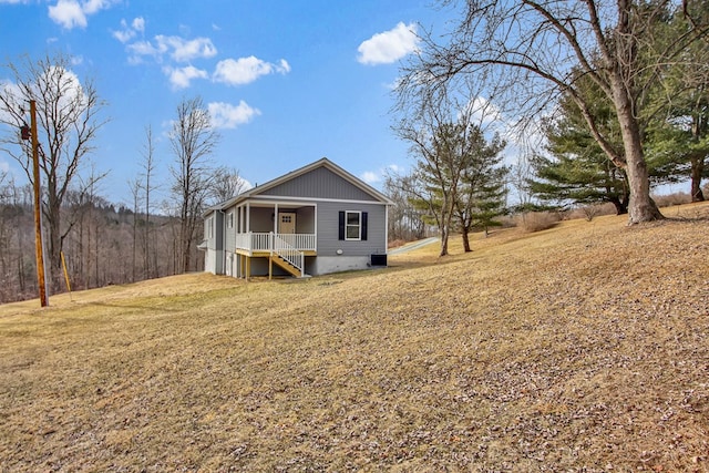 exterior space featuring a porch and a front lawn