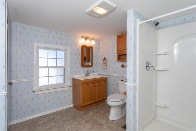 bathroom featuring walk in shower, vanity, and toilet