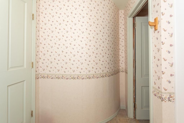 corridor featuring light tile patterned flooring