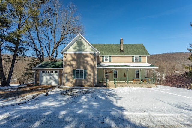 view of front facade with a garage and a porch