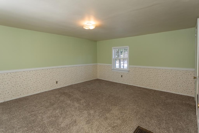 spare room featuring carpet