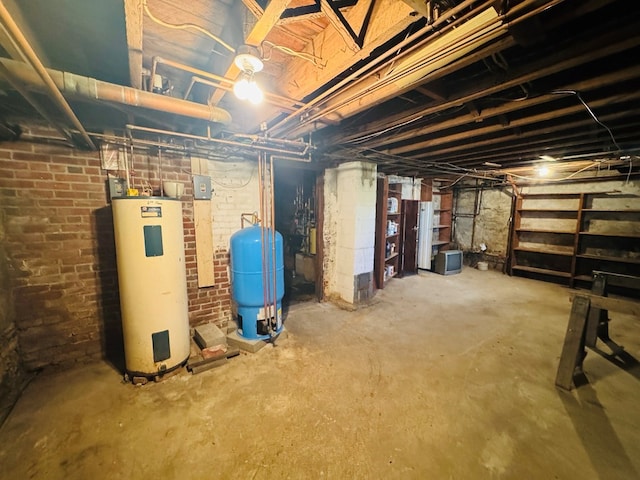 10 Ward Ave, Towanda, PA 18848 - unfinished below grade area featuring electric water heater and a water pressure tank