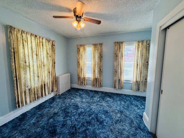10 Ward Ave, Towanda, PA 18848 - unfurnished room with radiator heating unit, carpet floors, a textured ceiling, a ceiling fan, and baseboards