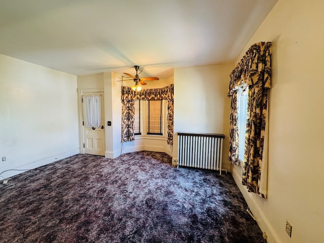 10 Ward Ave, Towanda, PA 18848 - carpeted empty room with radiator heating unit, a ceiling fan, and baseboards