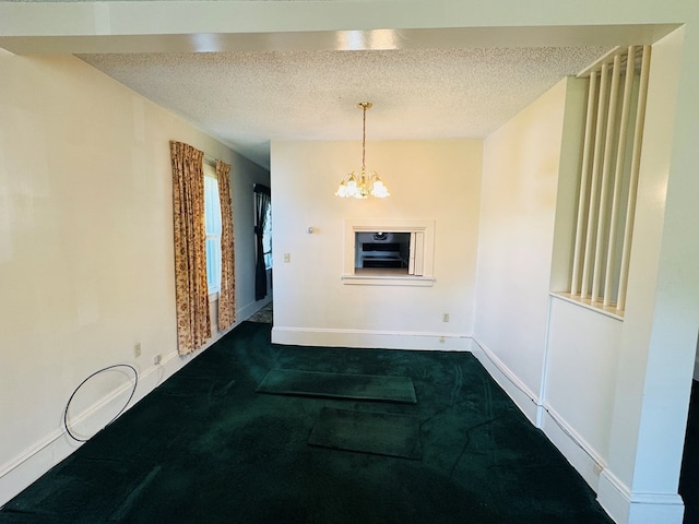 10 Ward Ave, Towanda, PA 18848 - spare room with a chandelier, a textured ceiling, baseboards, and dark carpet