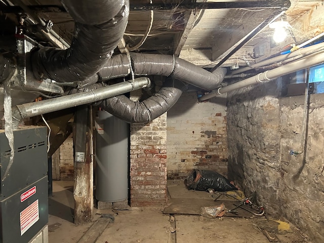 utility room featuring heating unit and gas water heater