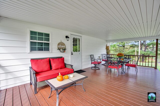 wooden deck featuring an outdoor hangout area