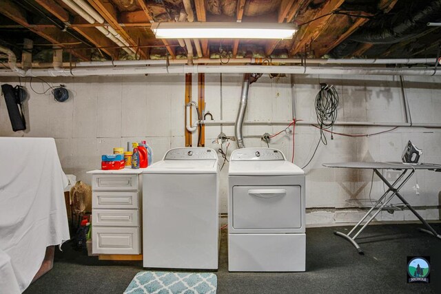 washroom with washer and dryer