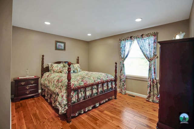 bedroom with light hardwood / wood-style flooring