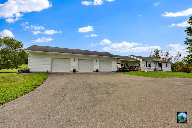 garage featuring a lawn