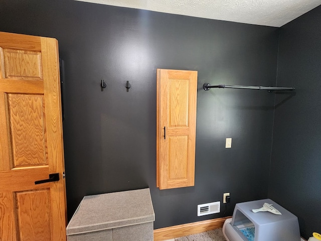 82 Cherry Tree Ln, Coudersport, PA 16915 - laundry area featuring baseboards