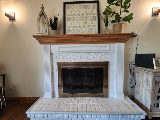 82 Cherry Tree Ln, Coudersport, PA 16915 - detailed view of wood finished floors, a brick fireplace, and baseboards