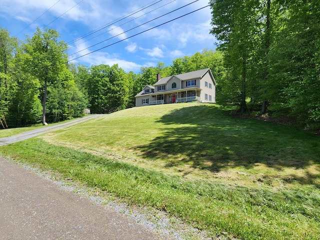 82 Cherry Tree Ln, Coudersport, PA 16915 - colonial inspired home with a chimney and a front lawn