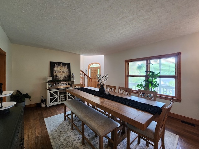 82 Cherry Tree Ln, Coudersport, PA 16915 - dining area with a textured ceiling, baseboards, and dark wood finished floors