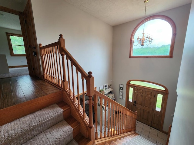 82 Cherry Tree Ln, Coudersport, PA 16915 - entrance foyer featuring a chandelier, stairway, wood-type flooring, and baseboards