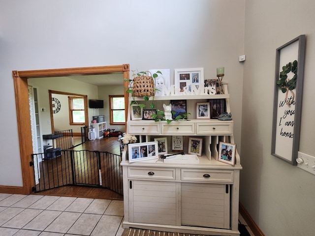 82 Cherry Tree Ln, Coudersport, PA 16915 - kitchen featuring light tile patterned floors, baseboards, and white cabinetry