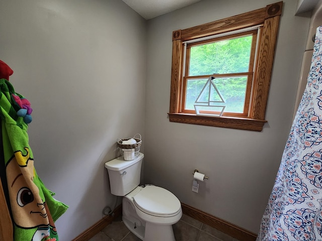 82 Cherry Tree Ln, Coudersport, PA 16915 - bathroom with toilet, baseboards, tile patterned flooring, and curtained shower