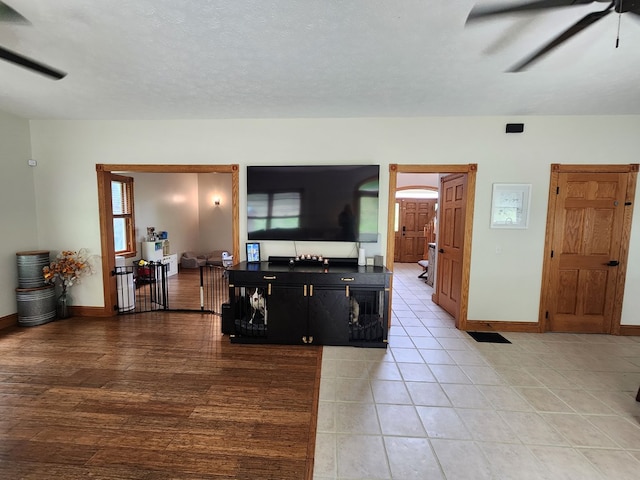 82 Cherry Tree Ln, Coudersport, PA 16915 - living room featuring a ceiling fan, baseboards, and light tile patterned floors