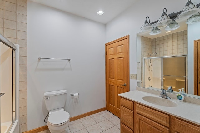 bathroom with tile patterned floors, vanity, and toilet