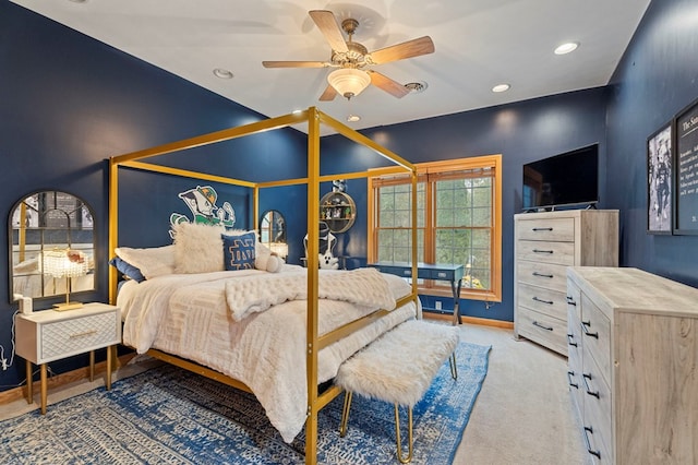 bedroom featuring ceiling fan and light colored carpet