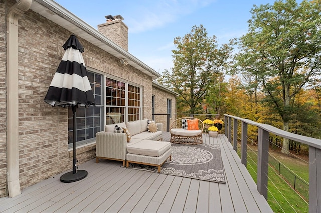 wooden terrace with outdoor lounge area