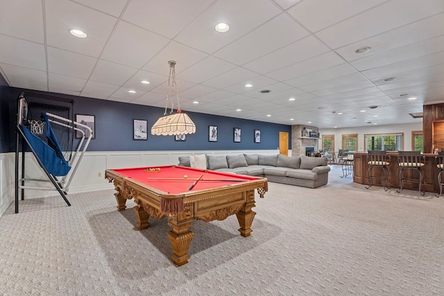 rec room with carpet, indoor bar, and pool table