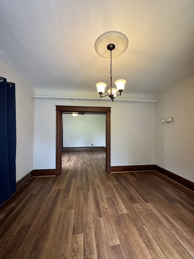 519 N Elk Ave, Kane, PA 16735 - unfurnished room with wood finished floors and a chandelier