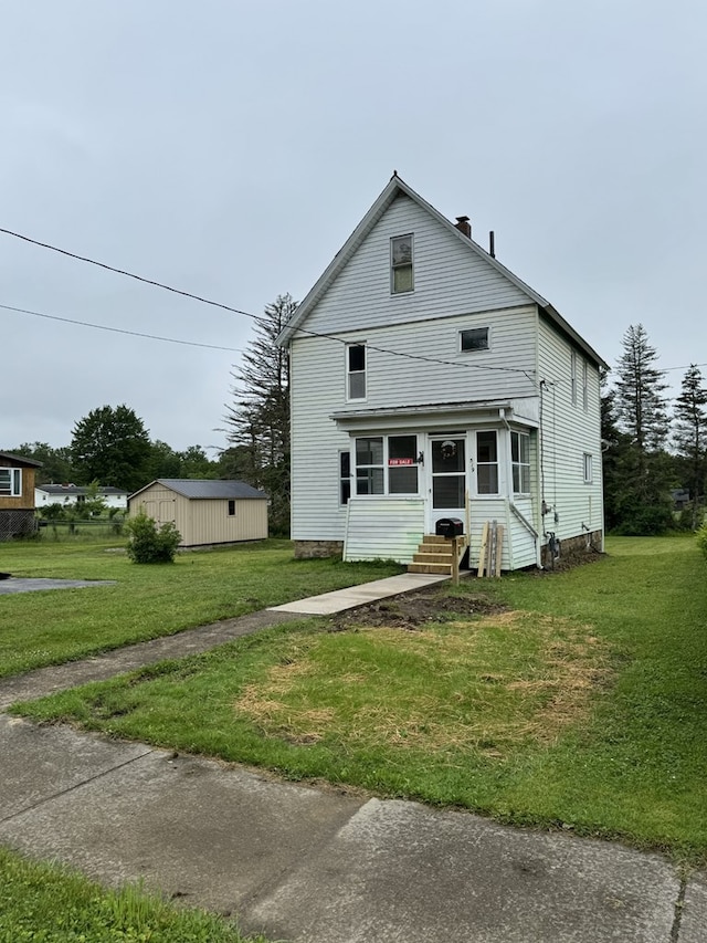 519 N Elk Ave, Kane, PA 16735 - view of front of property with entry steps, a front lawn, and an outbuilding