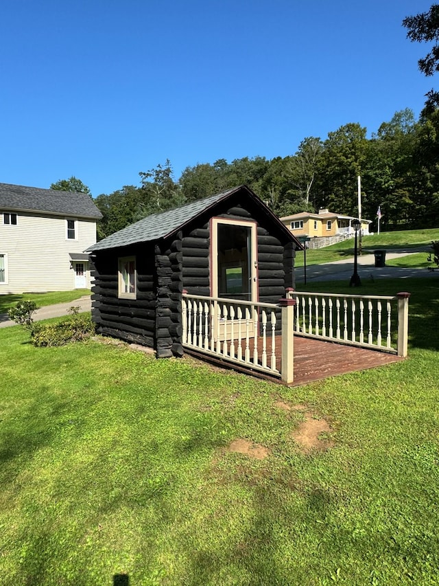 view of outbuilding featuring a yard